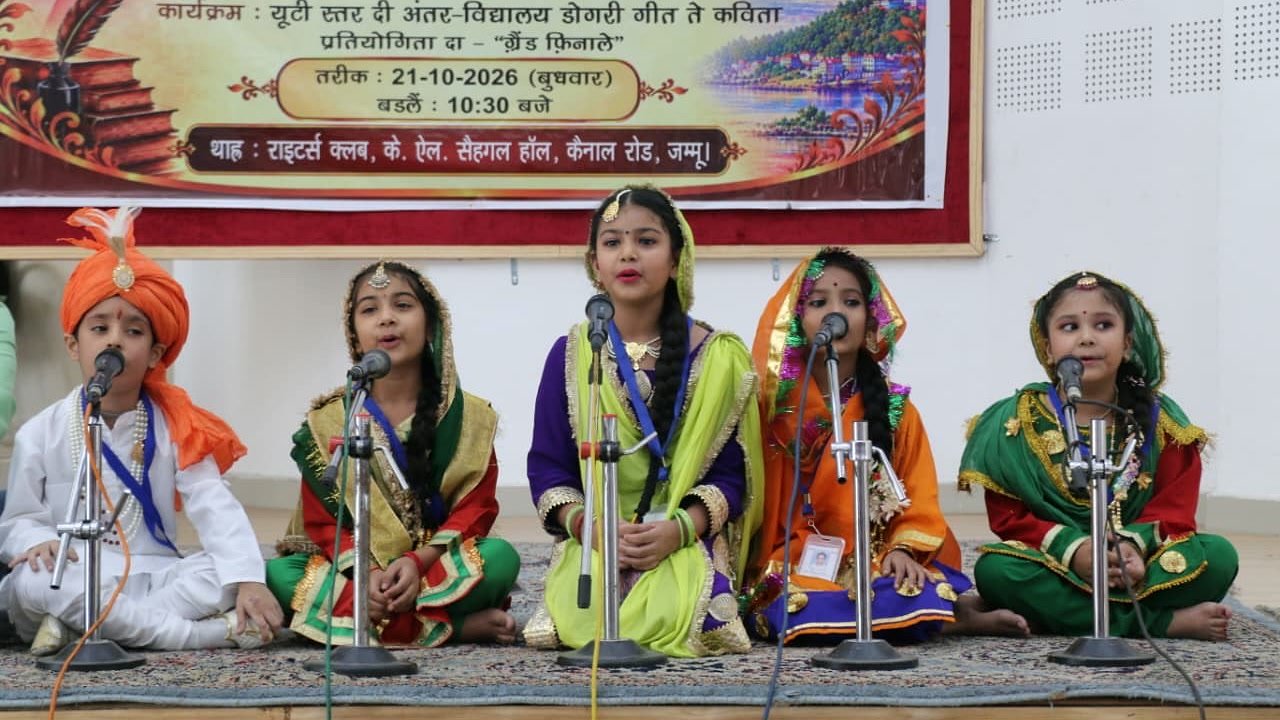 Five students in traditional dress singing together at microphones