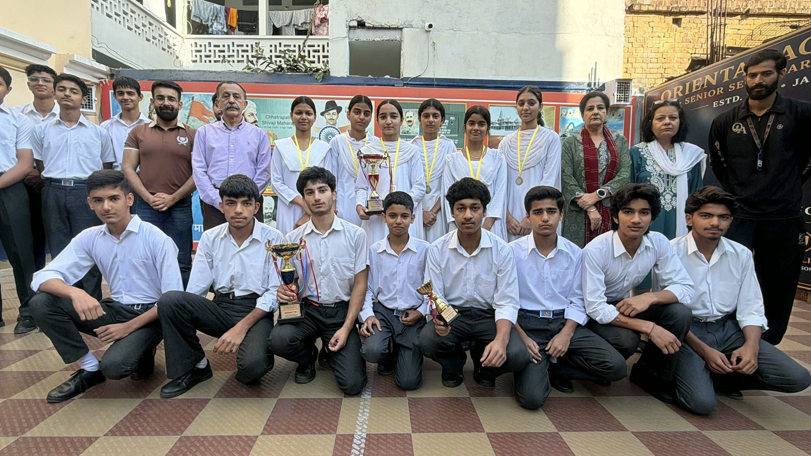 Both teams back at school with their trophies, the Principal and the Vice Principal
