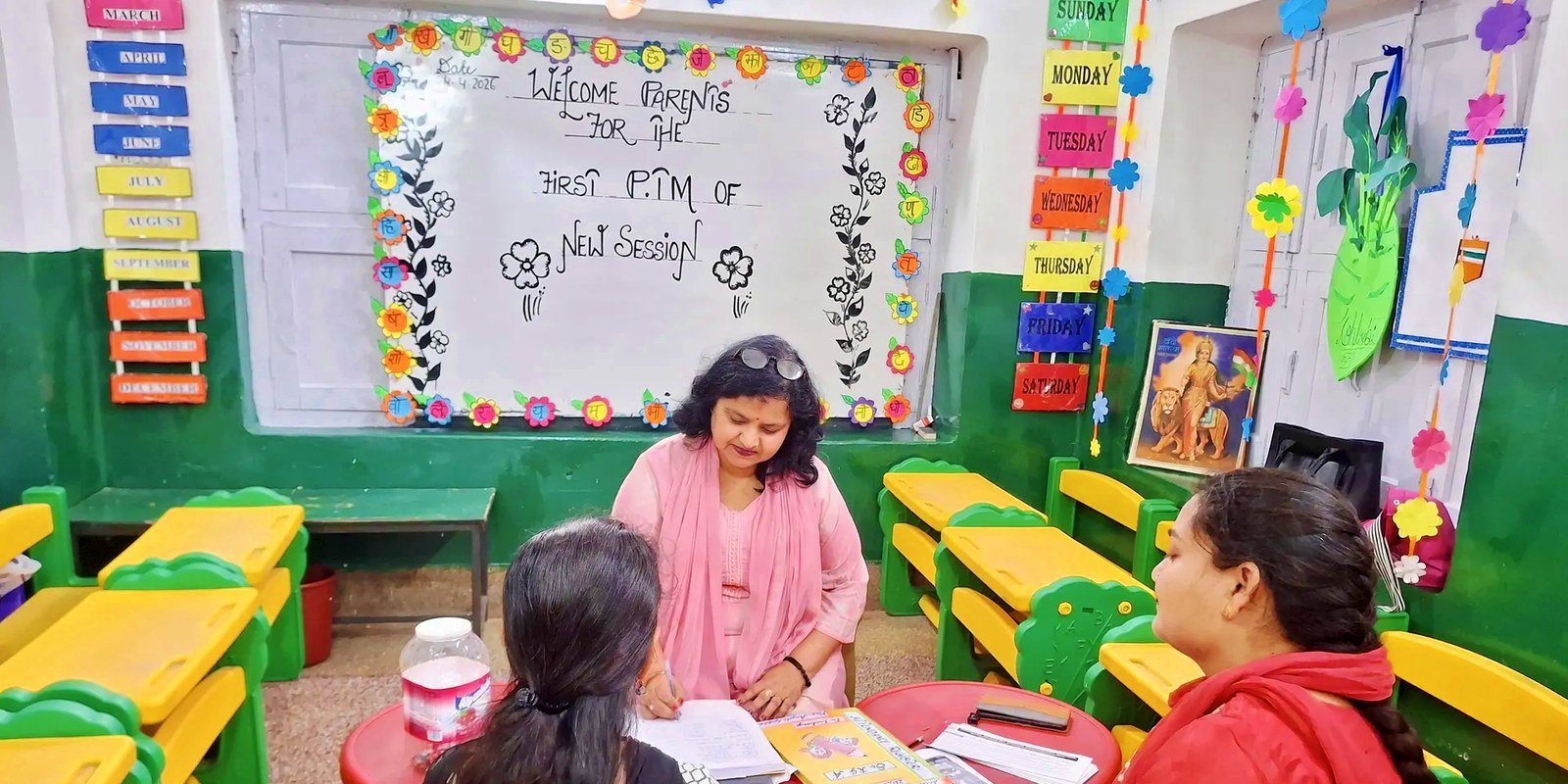 A teacher going through a child's record with two parents at the first parent-teacher meeting of the new session